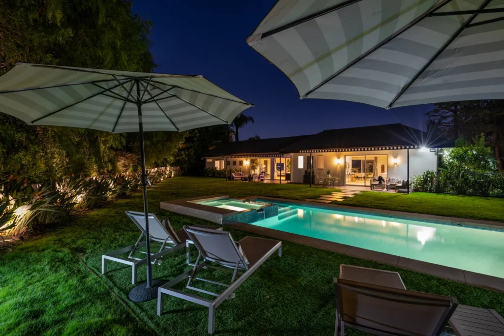Cozy backyard seating area in the Hollywood Hills with twilight ambiance.